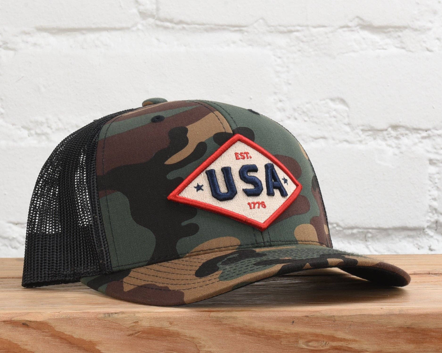USA Est. 1776 embroidered patch trucker hat, side mesh-back view