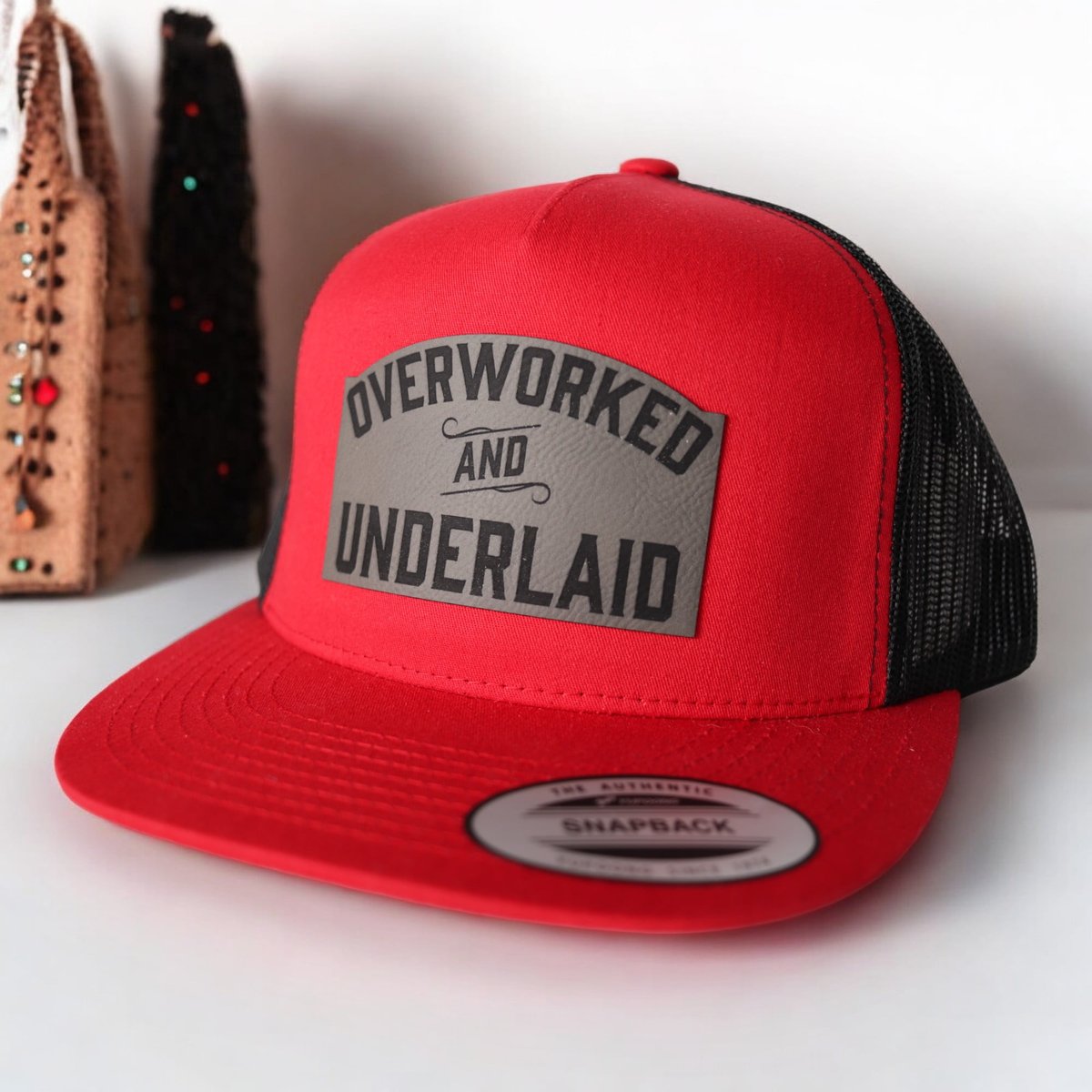 Overworked and Underlaid Trucker Hat