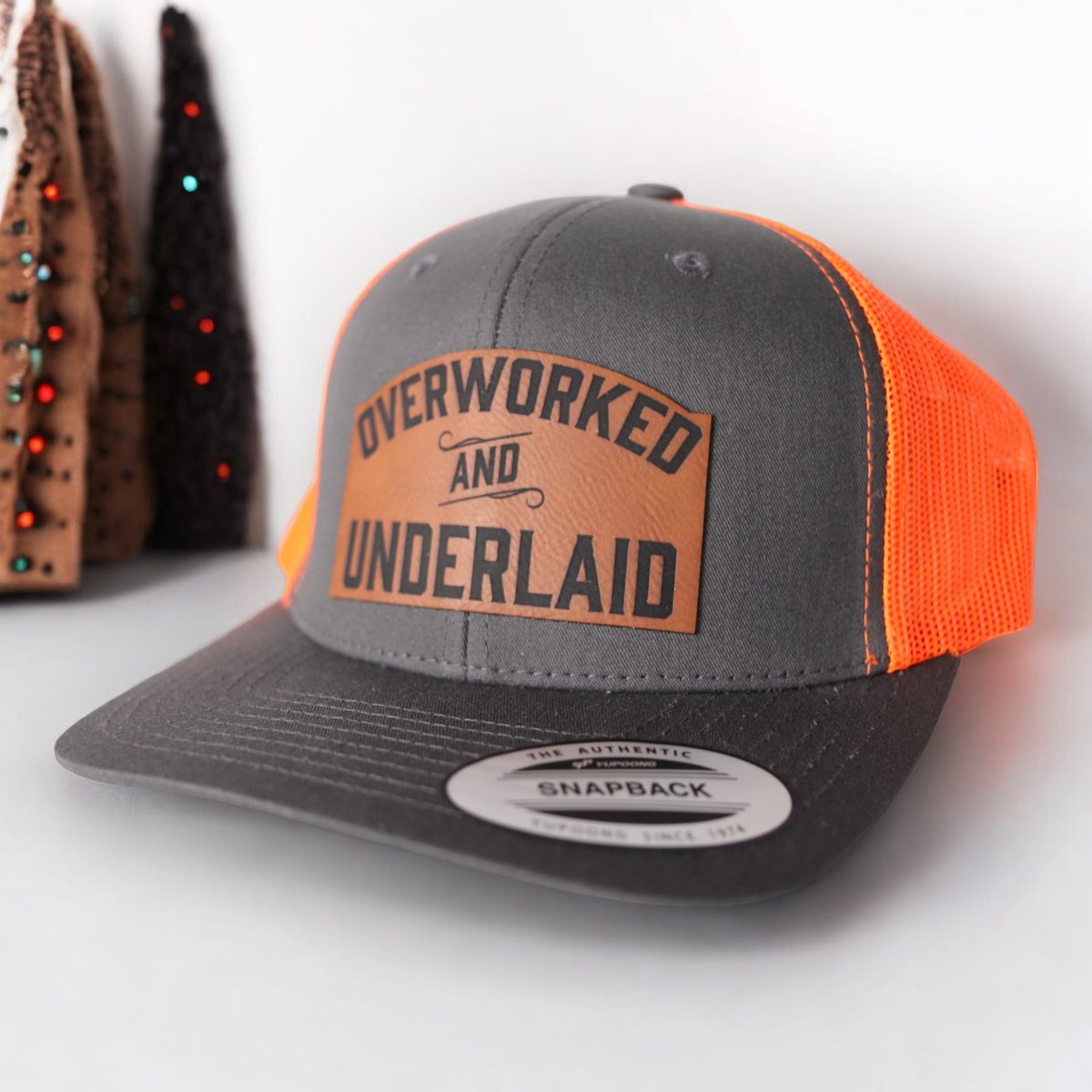 Overworked and Underlaid Trucker Hat