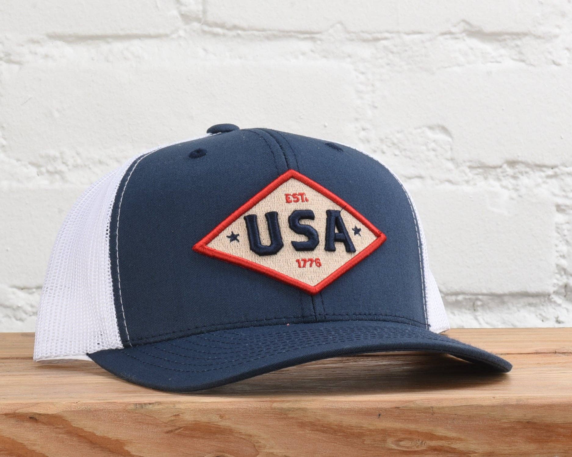 USA Est. 1776 embroidered patch trucker hat, close-up of USA 1776 patch